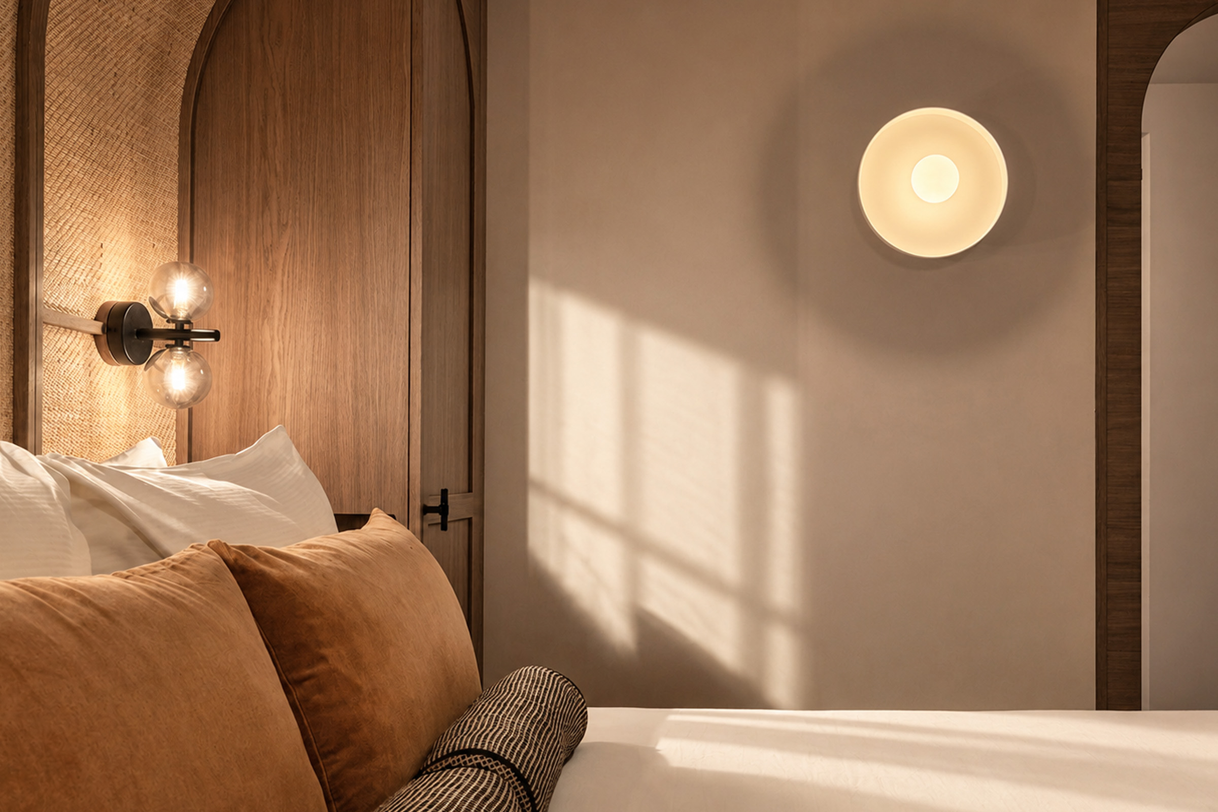 Custom bedside lighting detail in the Jan Luyken Amsterdam suite, designed by Studio Hank for a luxury boutique hotel experience.