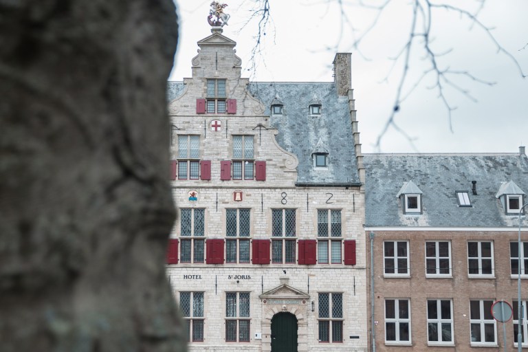Historic exterior of St Joris Doelen hotel, hospitality restoration and interior design by Studio Hank.
