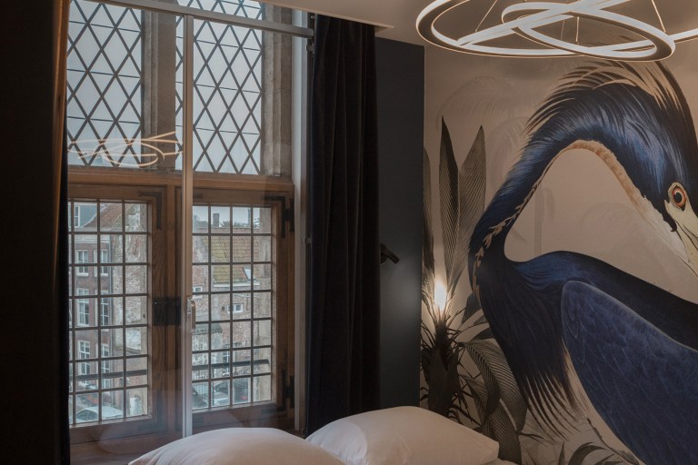 boutique hotel bedroom at St Joris Doelen, hospitality interior design by Studio Hank.